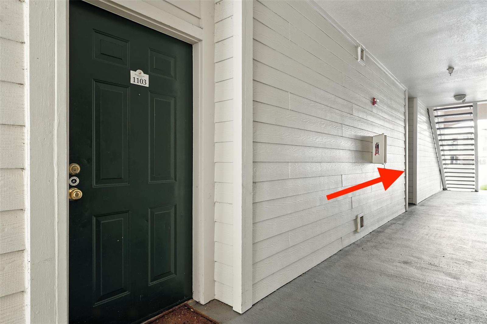Arrow shows how close garage and storage room is located to front door