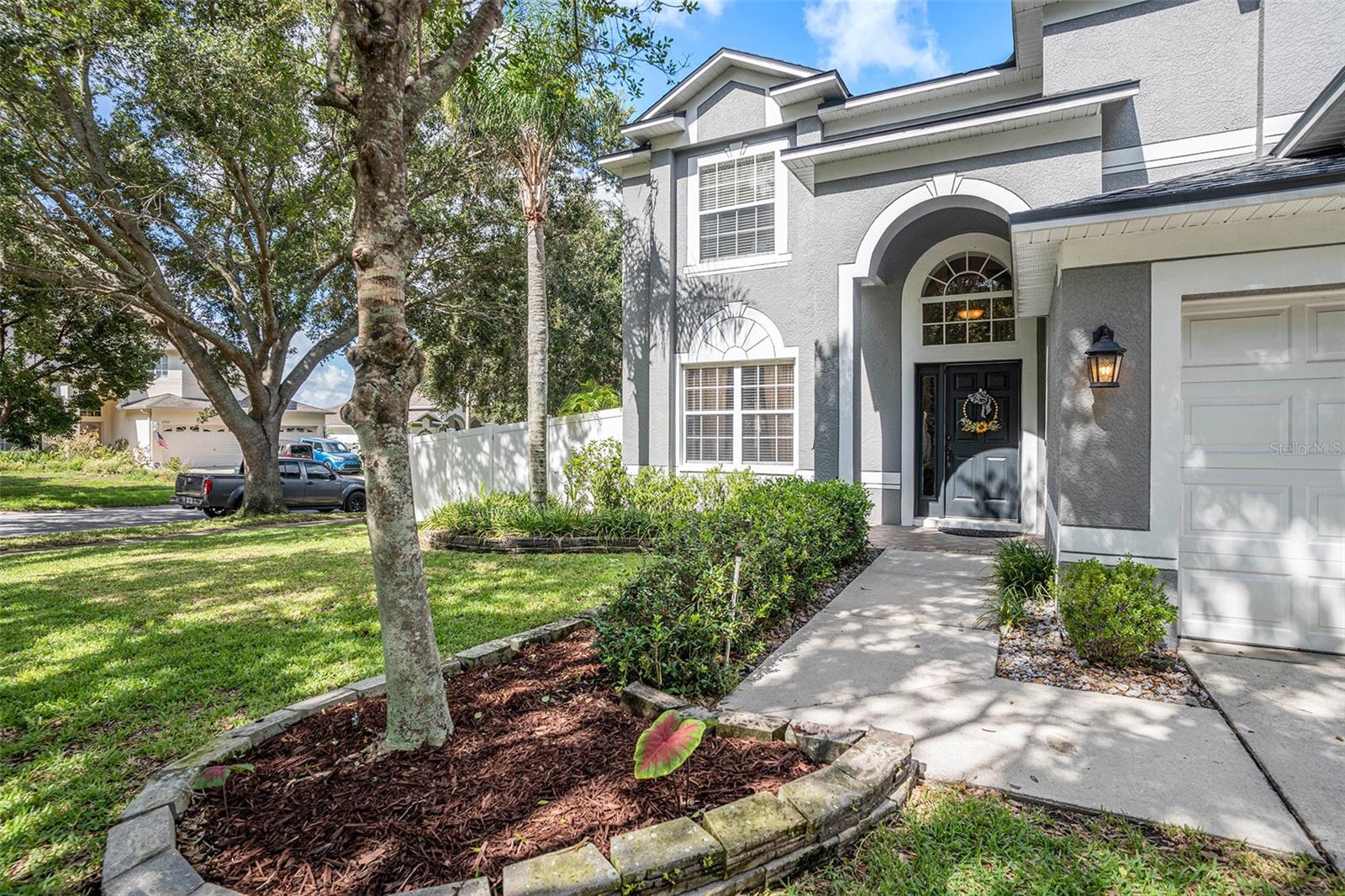 Beautifully landscaped frontyard in Buckhorn Preserve. LOW HOA & NO CDD!