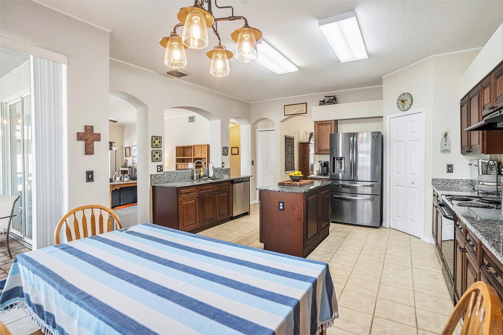 Breakfast nook in this large eat in kitchen with island and pantry