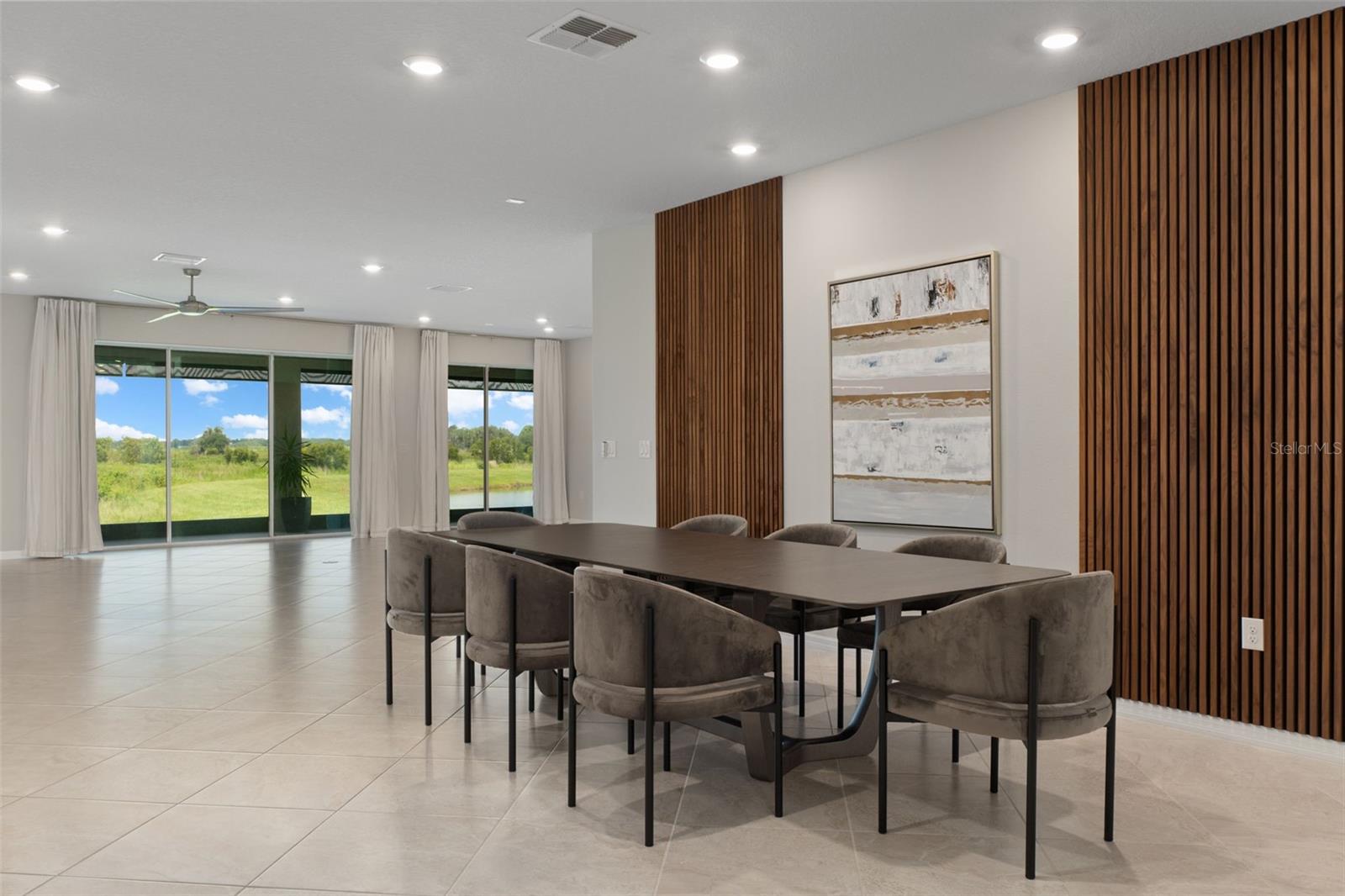Dining Room and Living Room looking towards lake. Diagonally laid tile in entire home