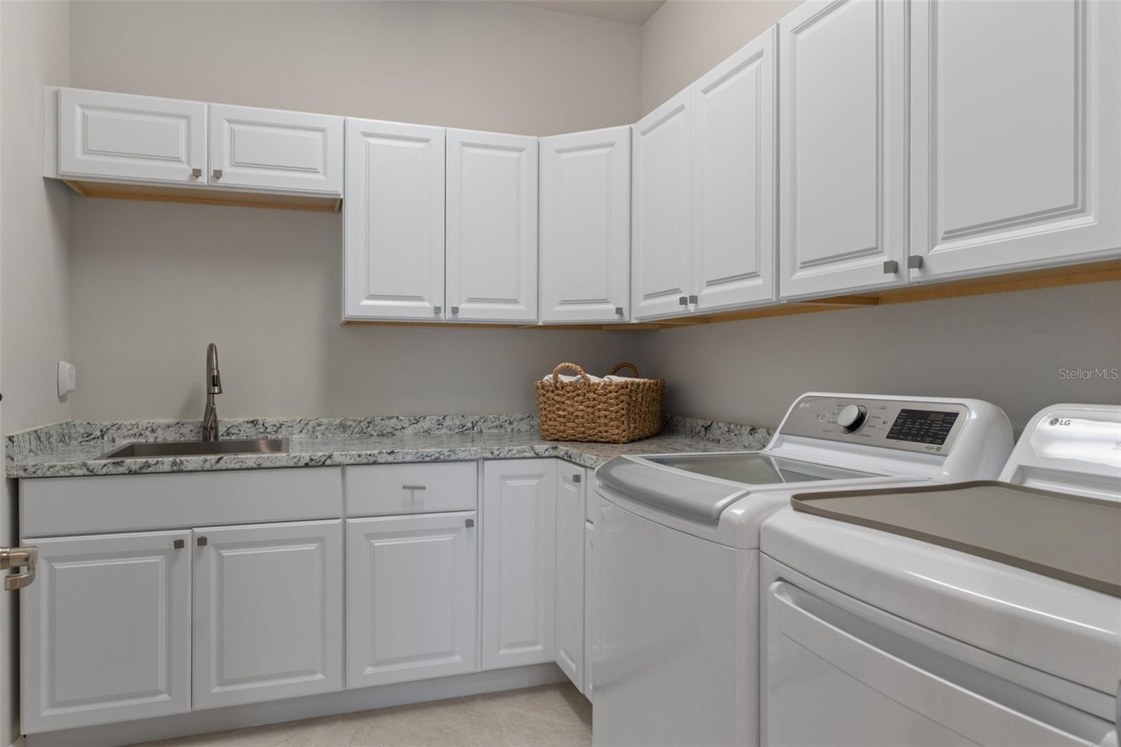 Laundry with great folding space and storage.