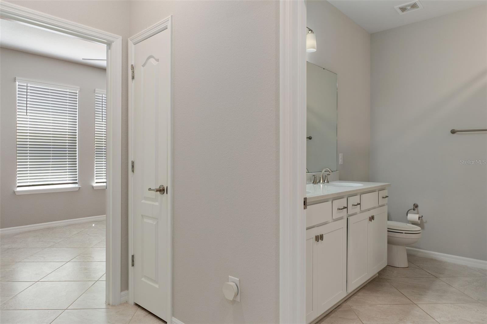 Bath 2 between Bedrooms 2 and 3. Tub shower to the right.