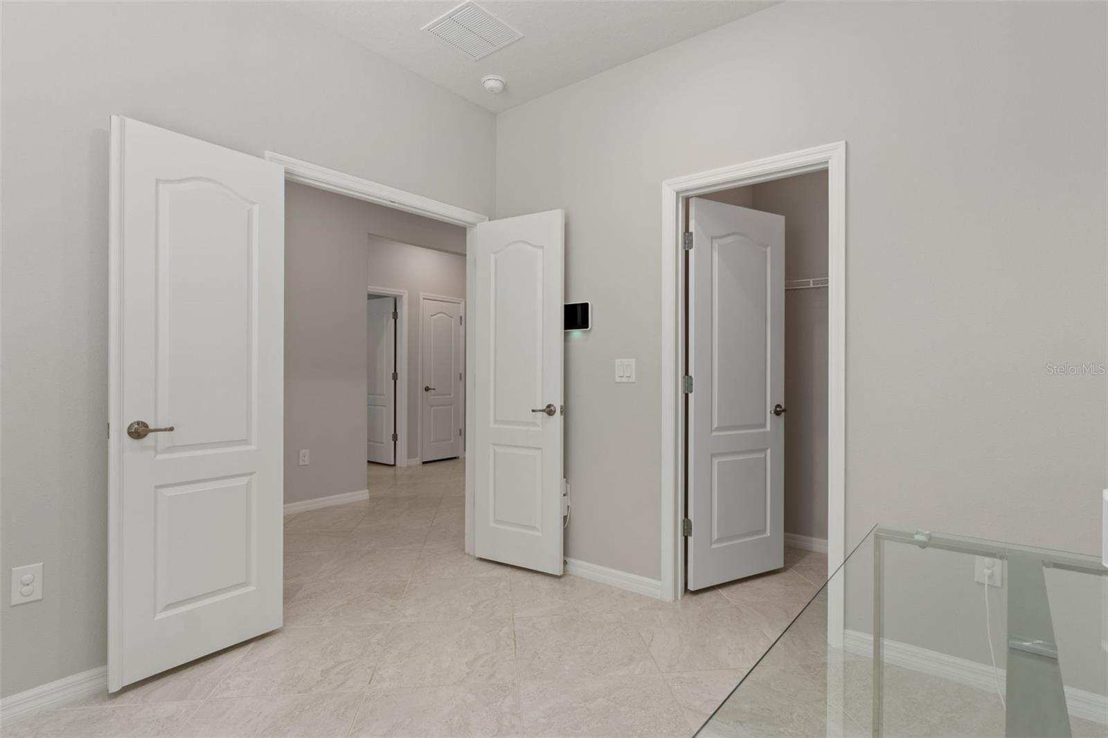 Bedroom 4/office with French doors and closet. Front of home to the right of the foyer.