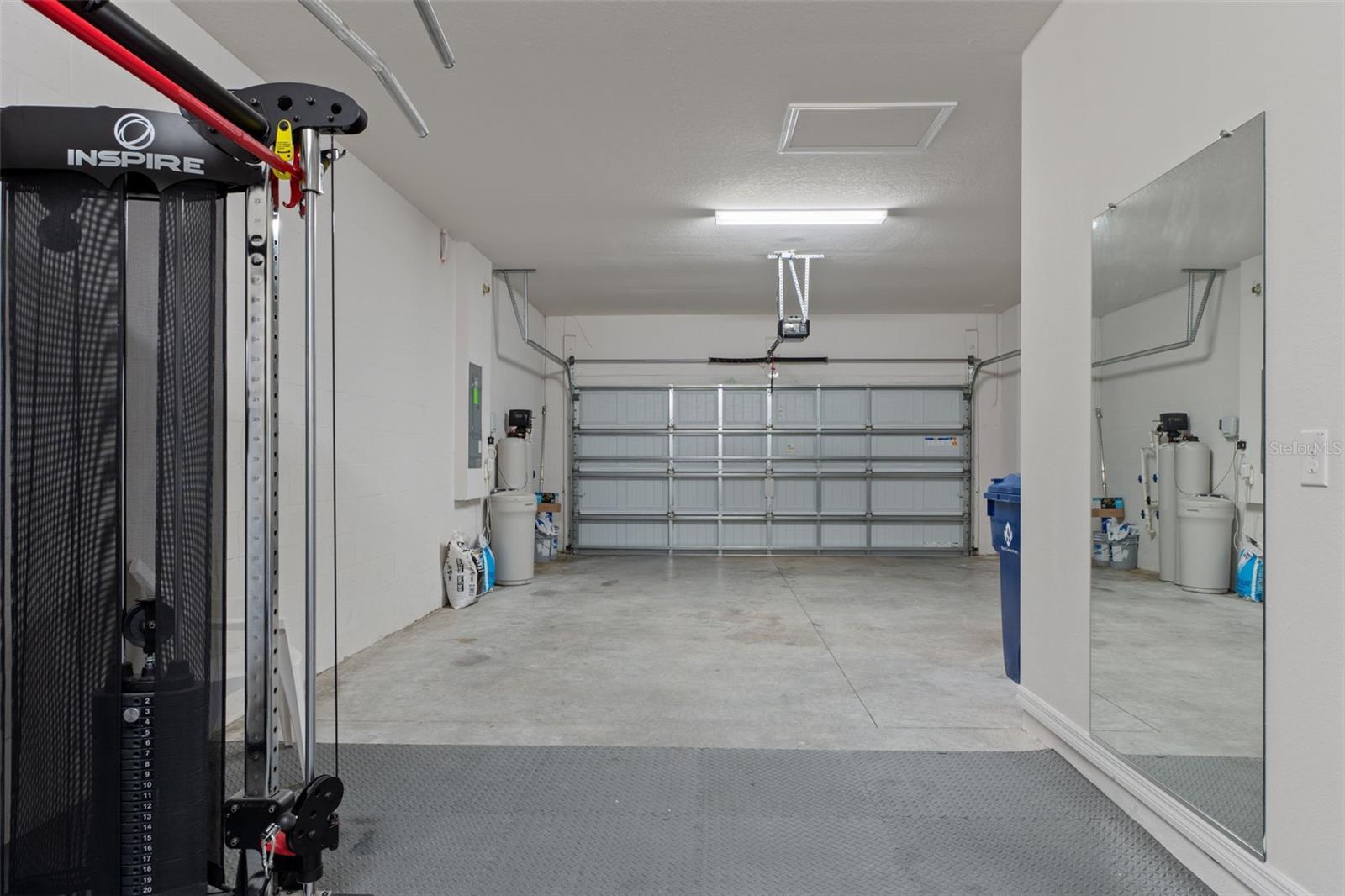 3 Car Tandem garage. Perfect for golf cart or mid sized 3 cars. Area being used for fitness space now.