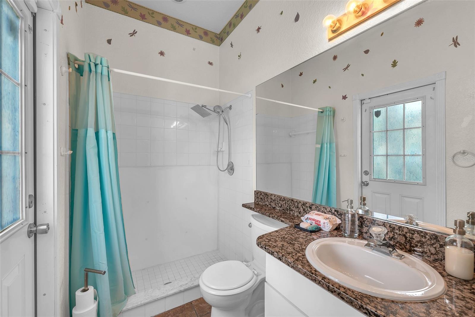 Bath 3 has a door leading out to the pool area. No wet bathing suits running through the house!