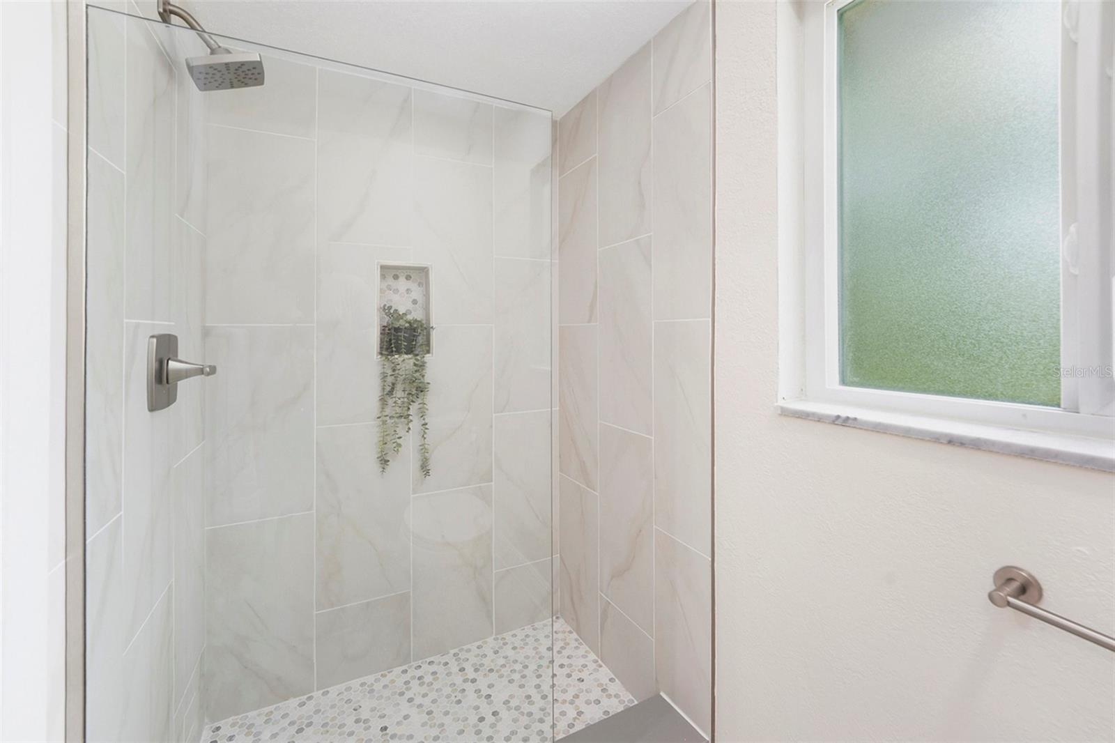 Primary bathroom's frameless shower
