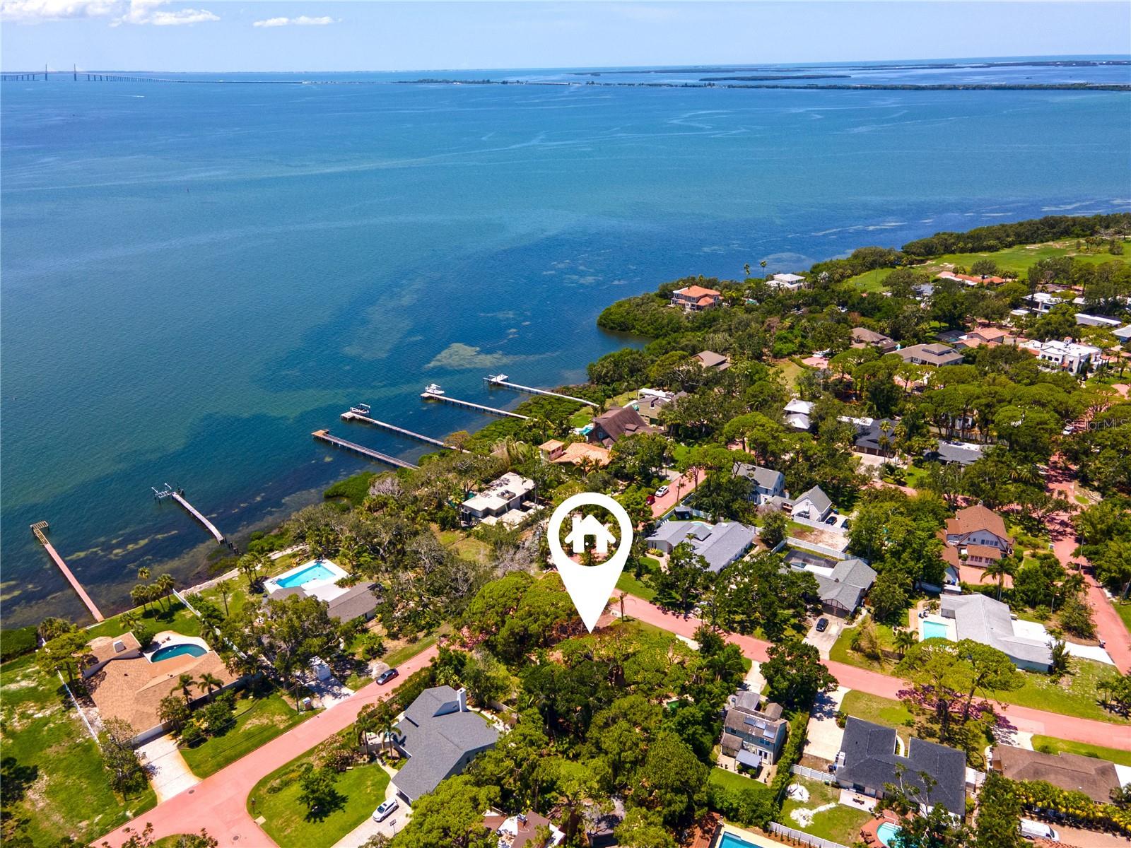Expansive corner lot across the street from open Tampa Bay, views of Sunshine Skyway Bridge