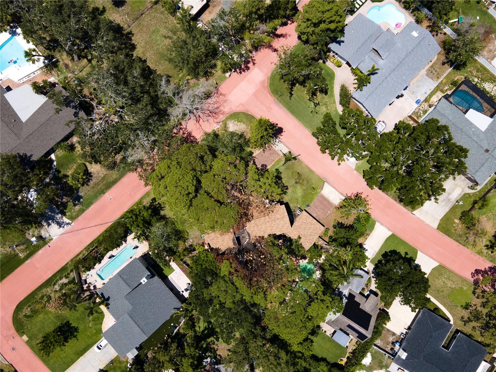 Canopied with trees, the lot is an impressive 19,105 sq feet.