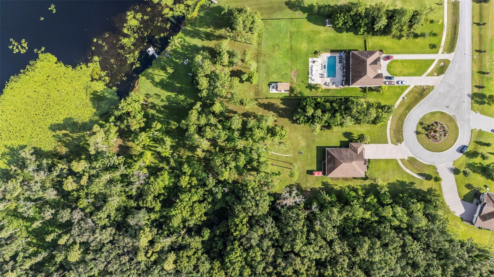 Aerial shot of home next to conservation on cul-de-sac