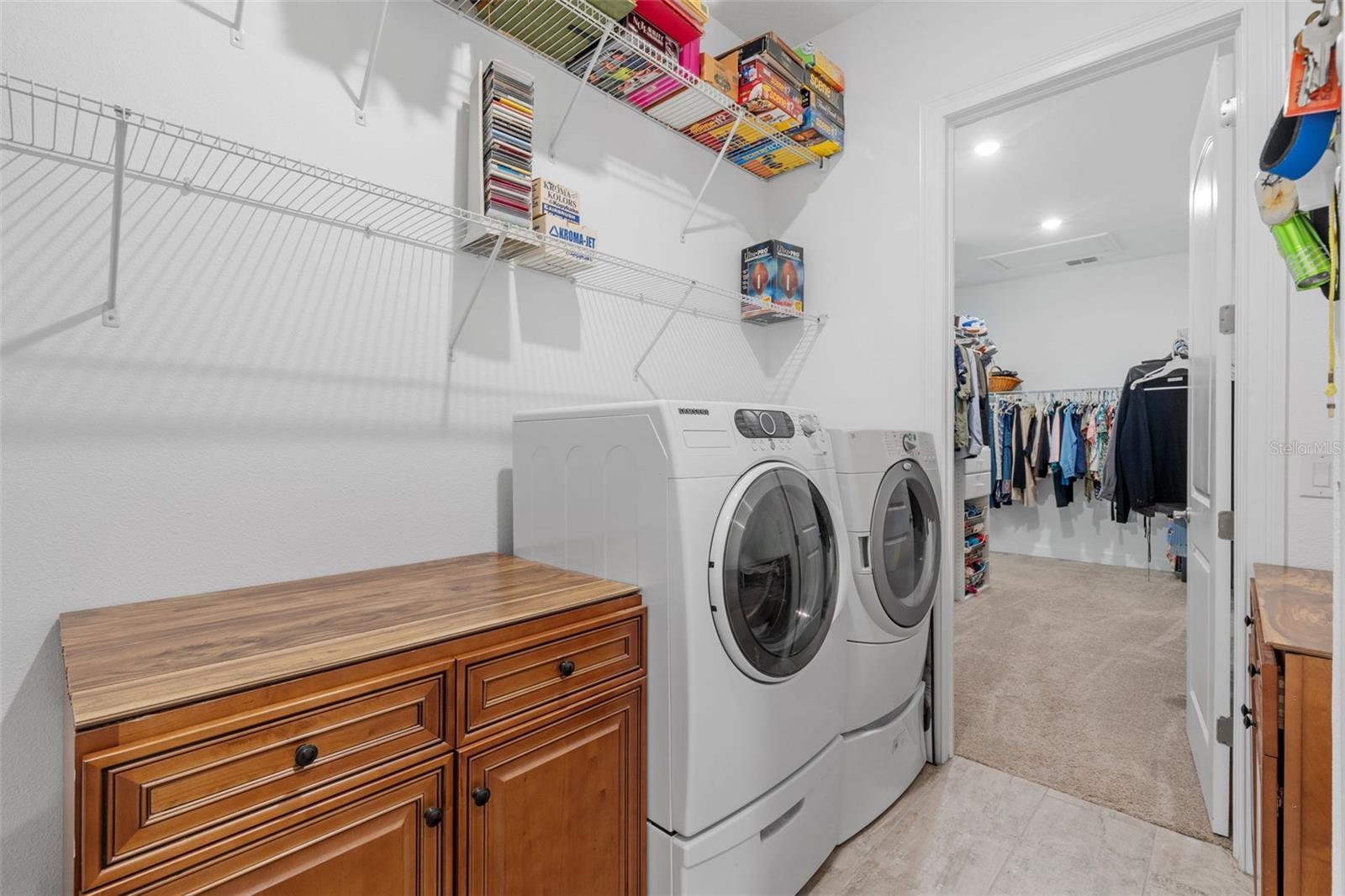 Laundry room directly from primary walk-in closet