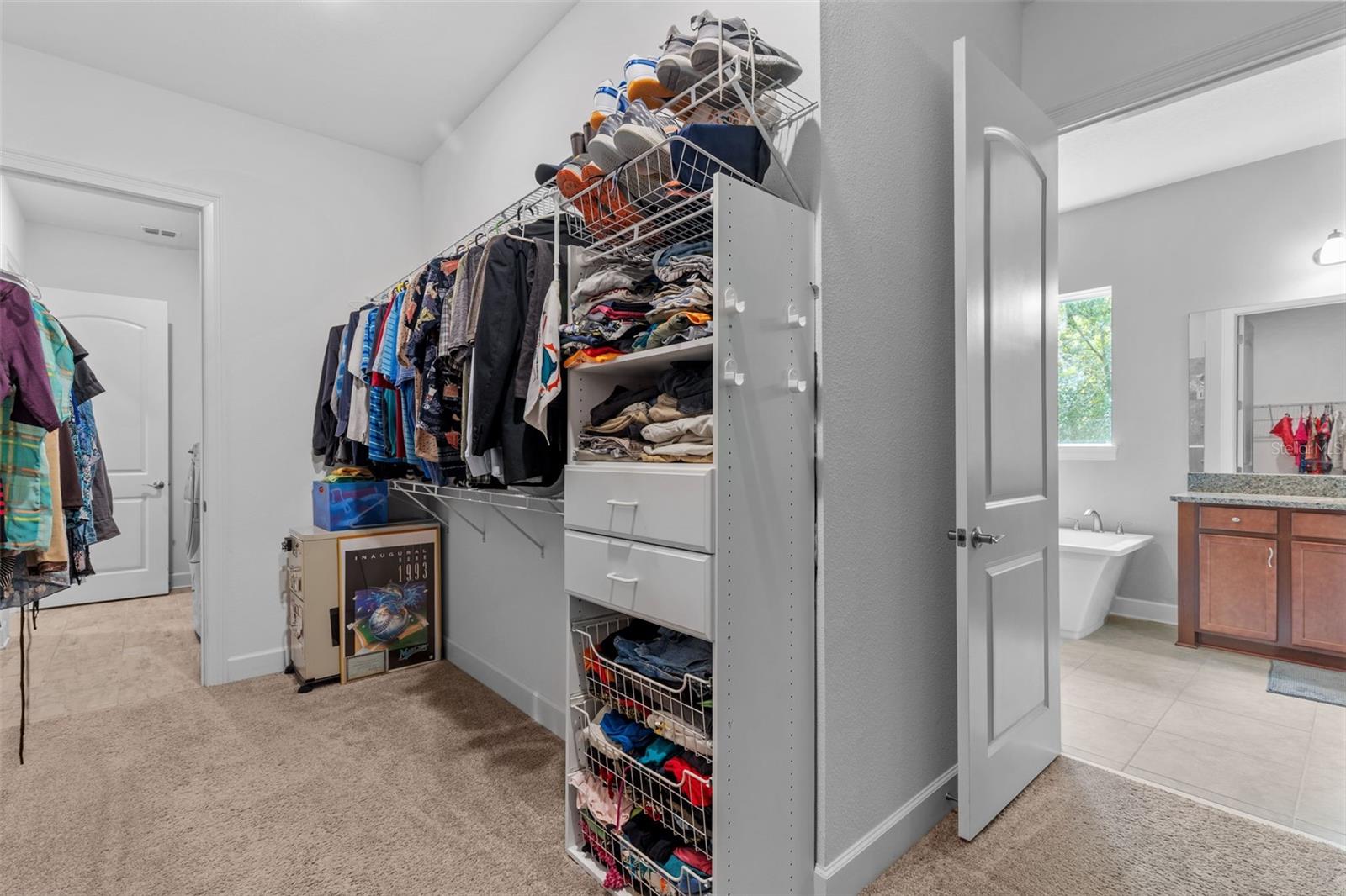 Large primary wrap around walk-in closet