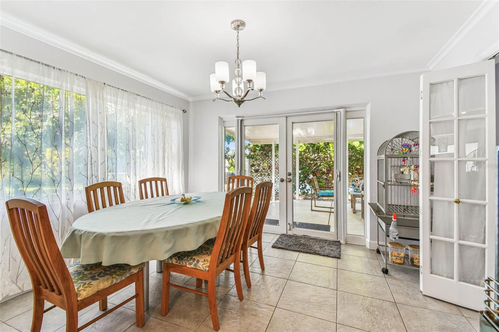 Currently used as dining room, space is ideal as "Florida room" with french doors out to covered patio