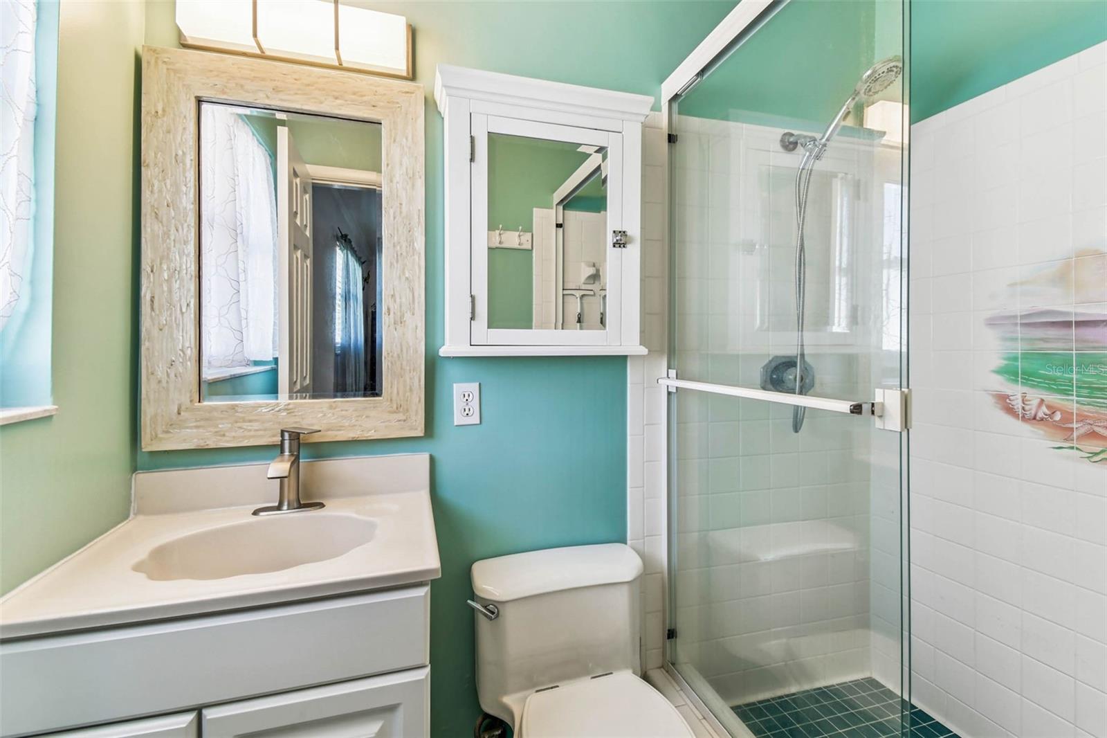 En-suite bath with shower