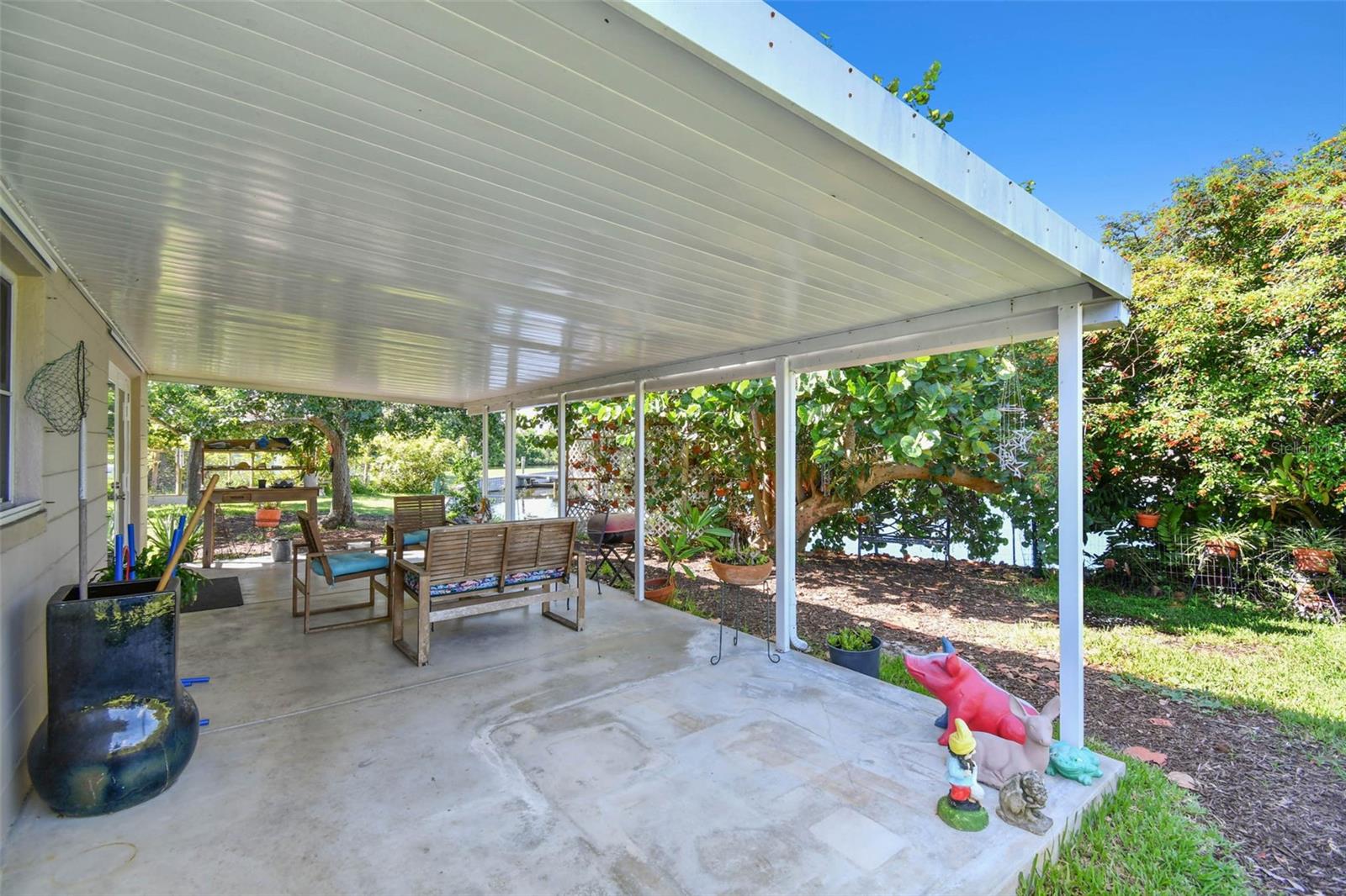 Spacious covered patio area with water views