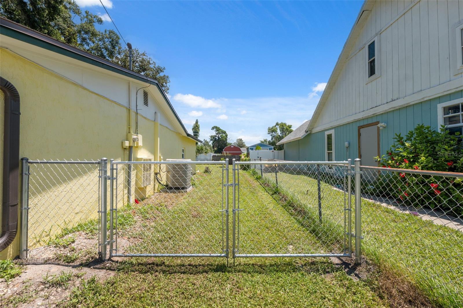 Fenced yard with wide gate
