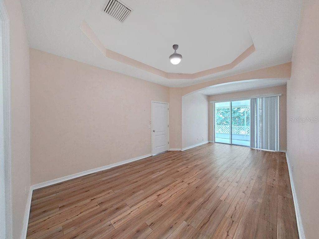Huge Primary Bedroom with Seating Area and Access to Screened Porch