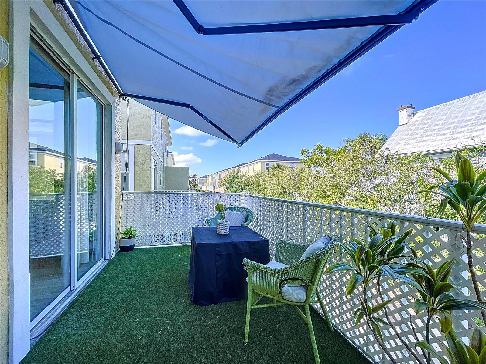 Open balcony off of main floor with retractable awning.