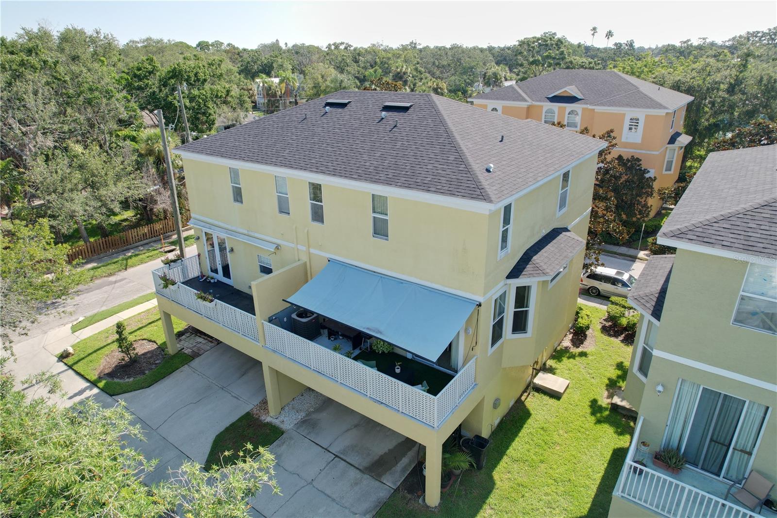 Rear of building showing balcony with retractable awning