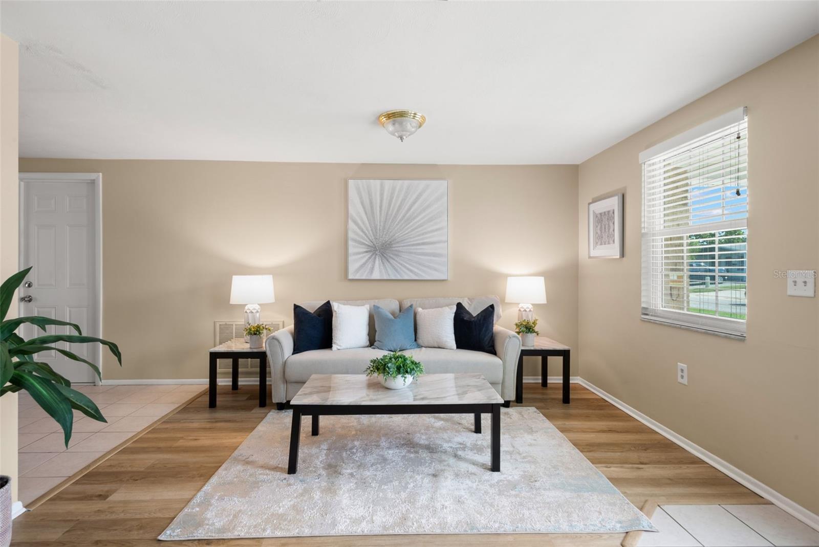 Room for plenty of seating with 2 picture windows providing natural light.