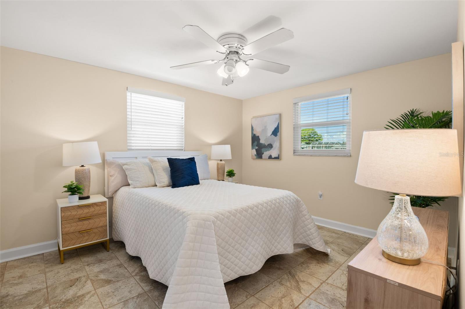 Primary bedroom with waterfront views.