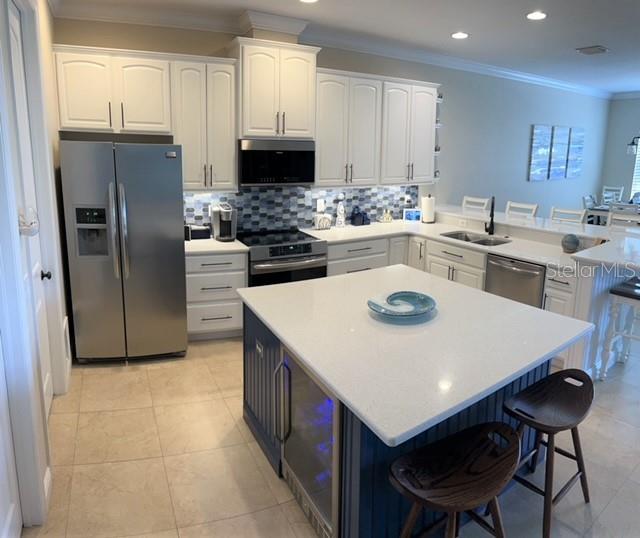 Kitchen with 2 beverage refrigerators