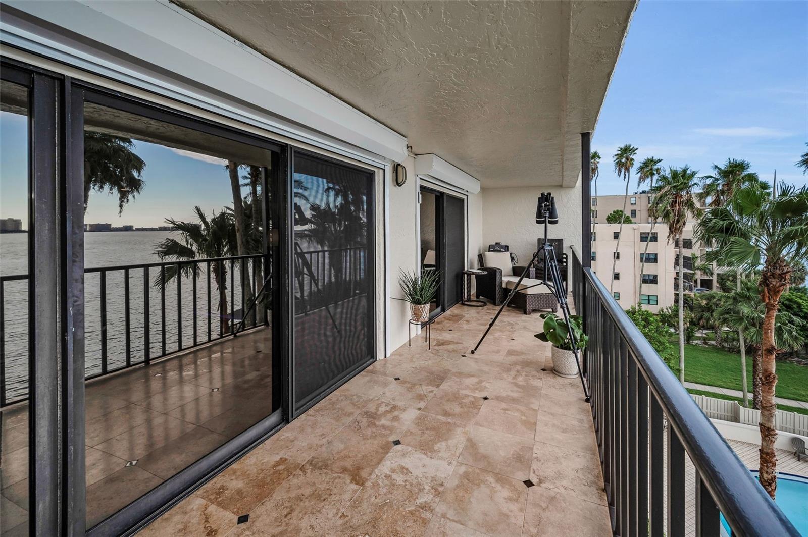 Double set of sliders giving access from living room and master bedroom to balcony