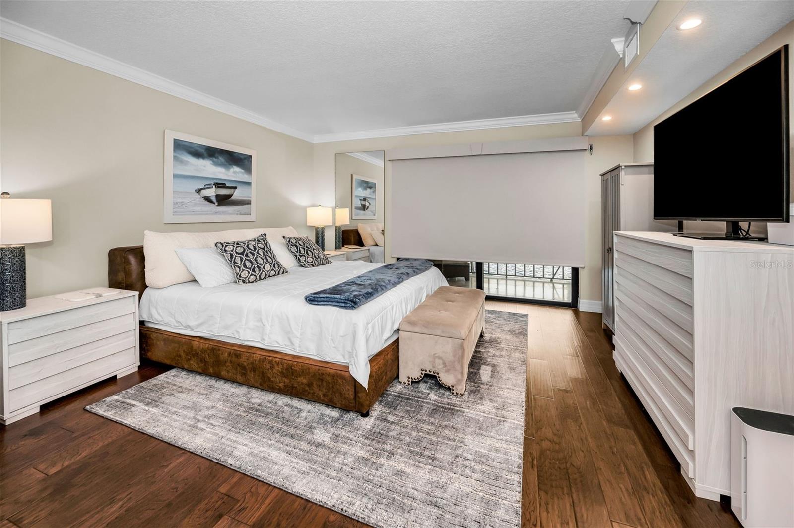 Custom WiFi-enabled motorized room-darkening blinds on bedroom sliders