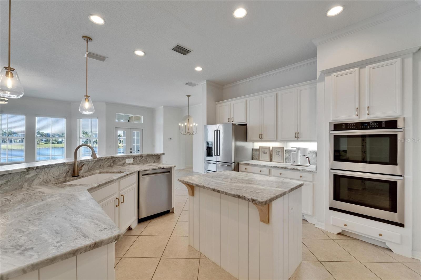 Double ovens in this open kitchen