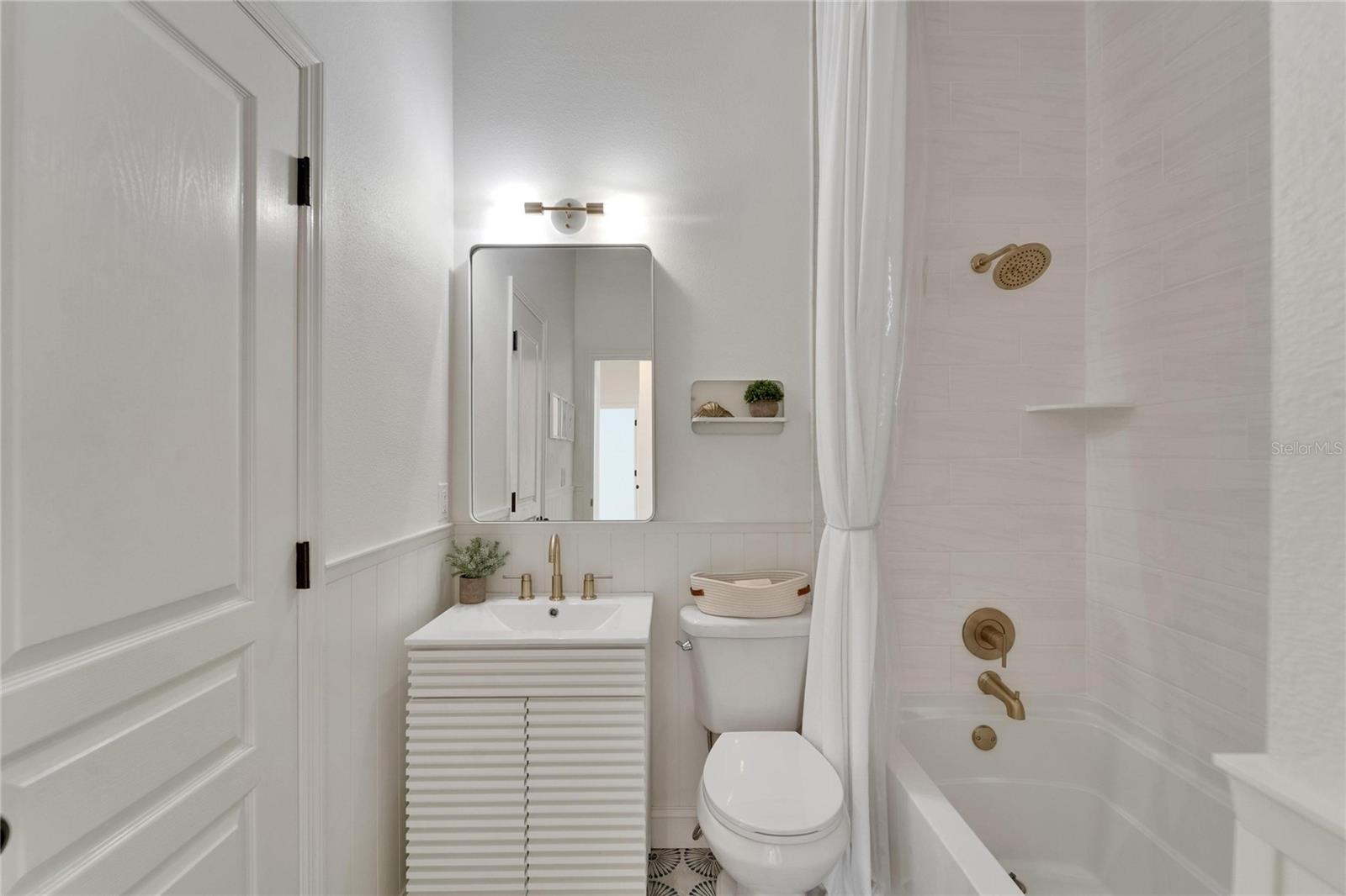 One of the 3 full bathrooms connected to the bedroom