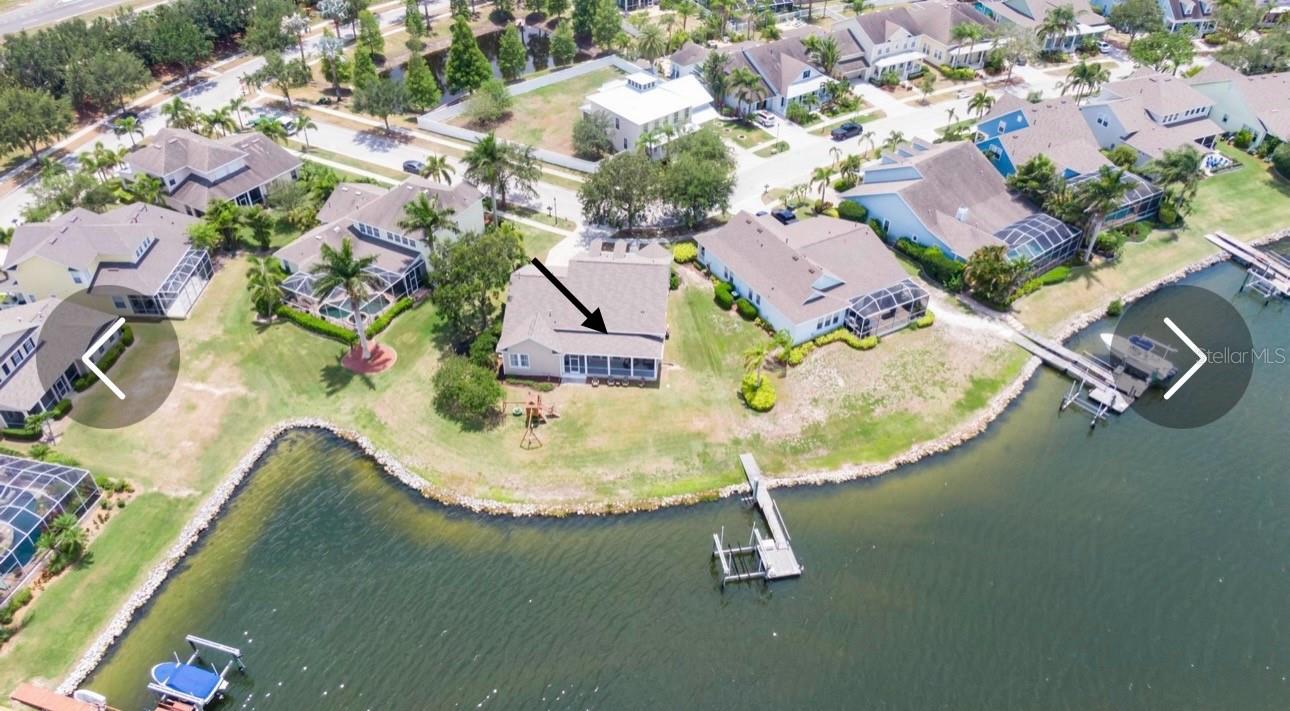 Backyard, boat dock with jet skis and boat lift