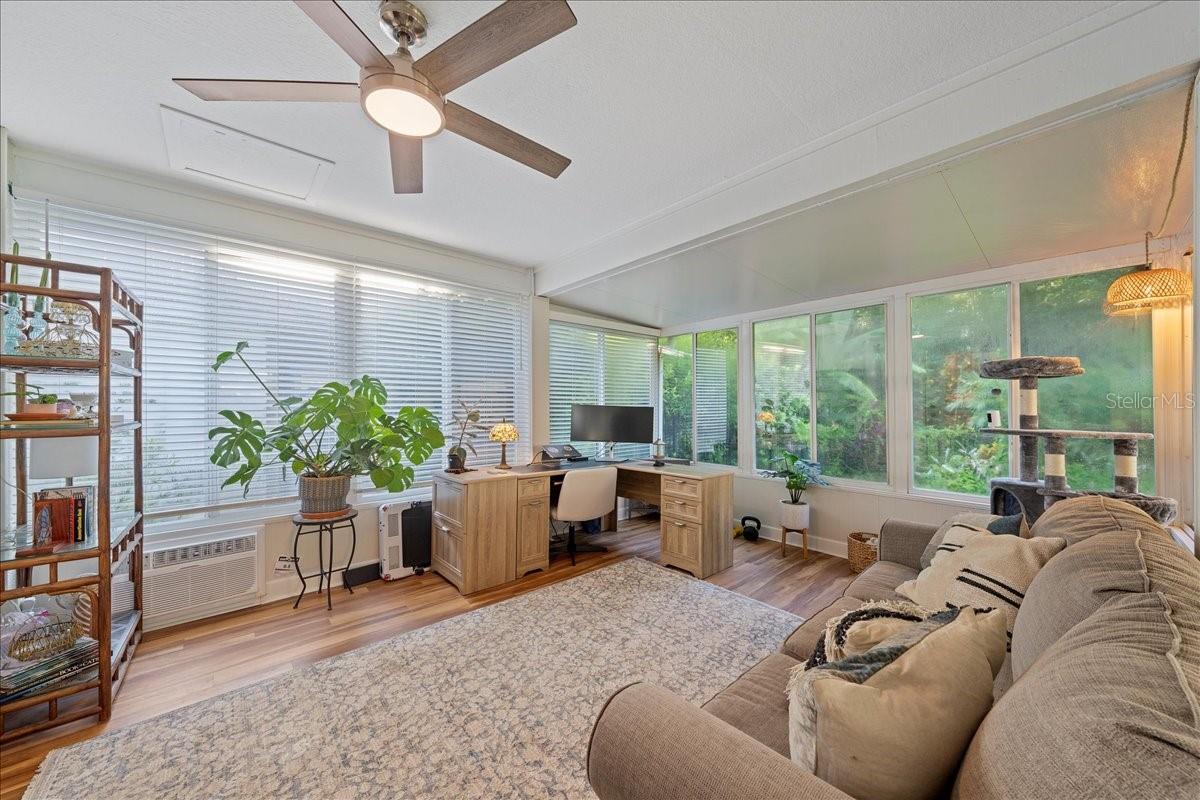 Florida room with AC, window surround. Ideal for home office, play room, reading and relaxing or flex space.