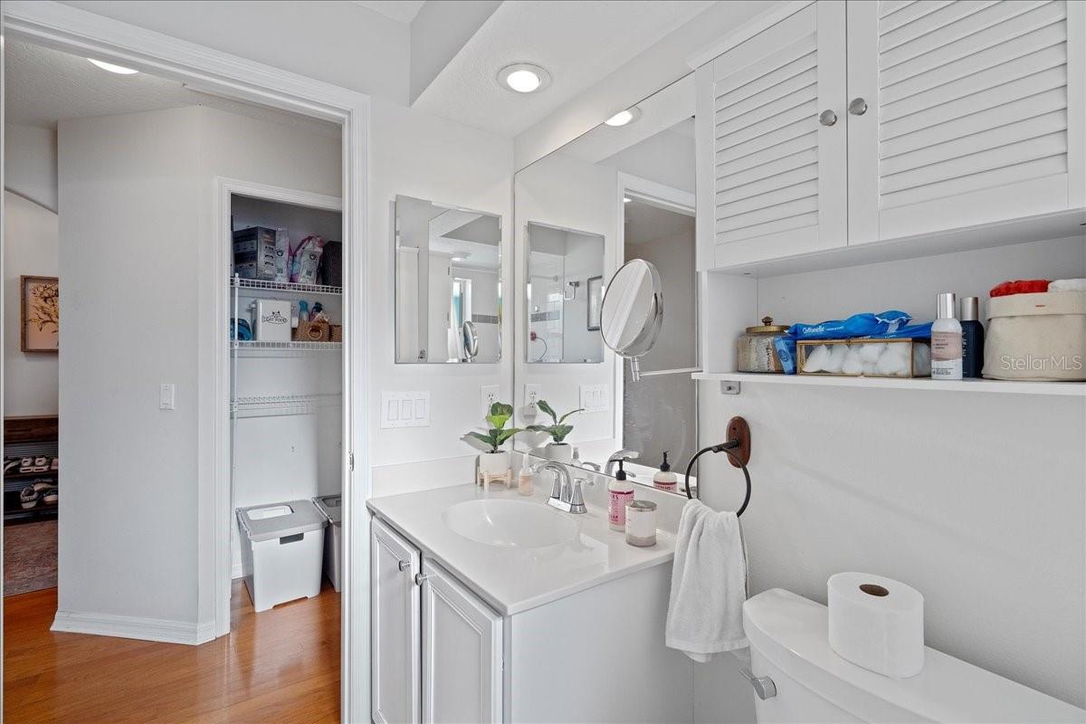 White and bright second bathroom with shower/tub combo and linen closet just across the hall.