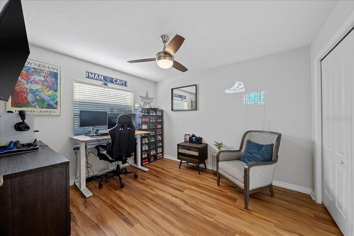 Third bedroom with beautiful new luxury vinyl floors and large wall closet