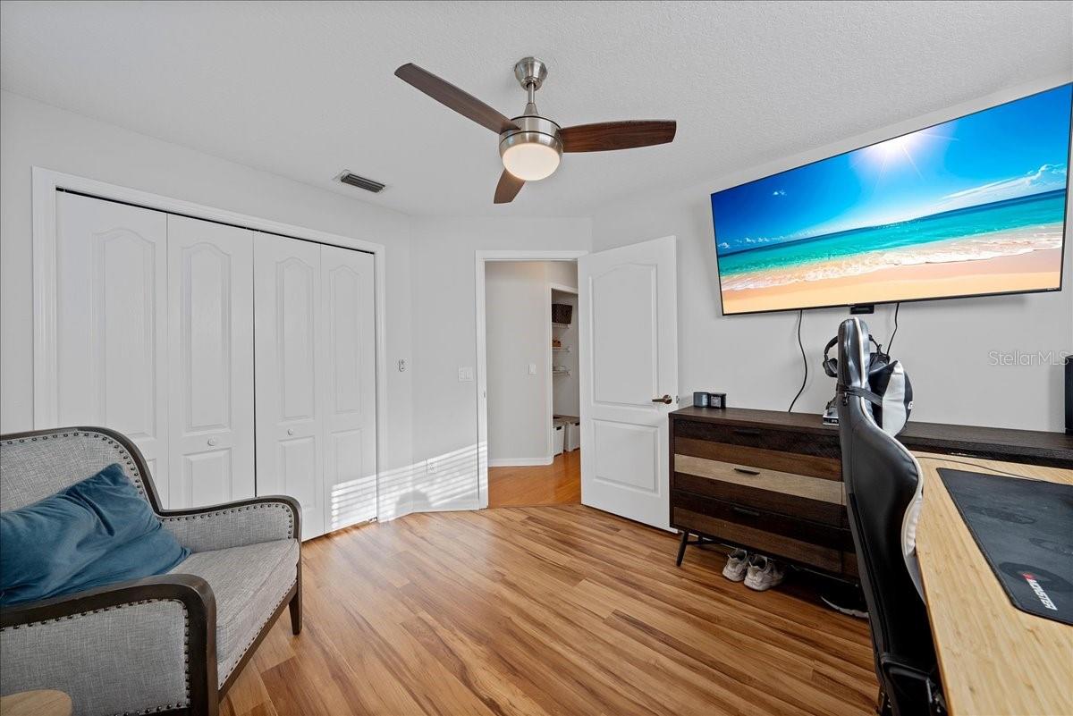 Third bedroom with beautiful new luxury vinyl floors and large wall closet