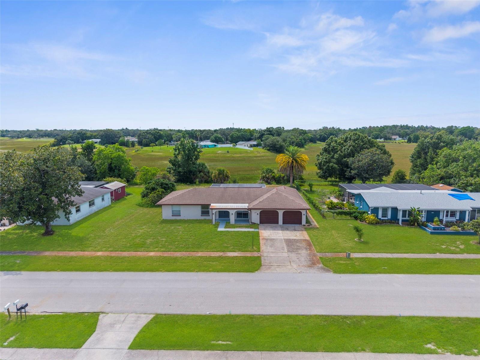 Over 1/4 acre, private views and no HOA.