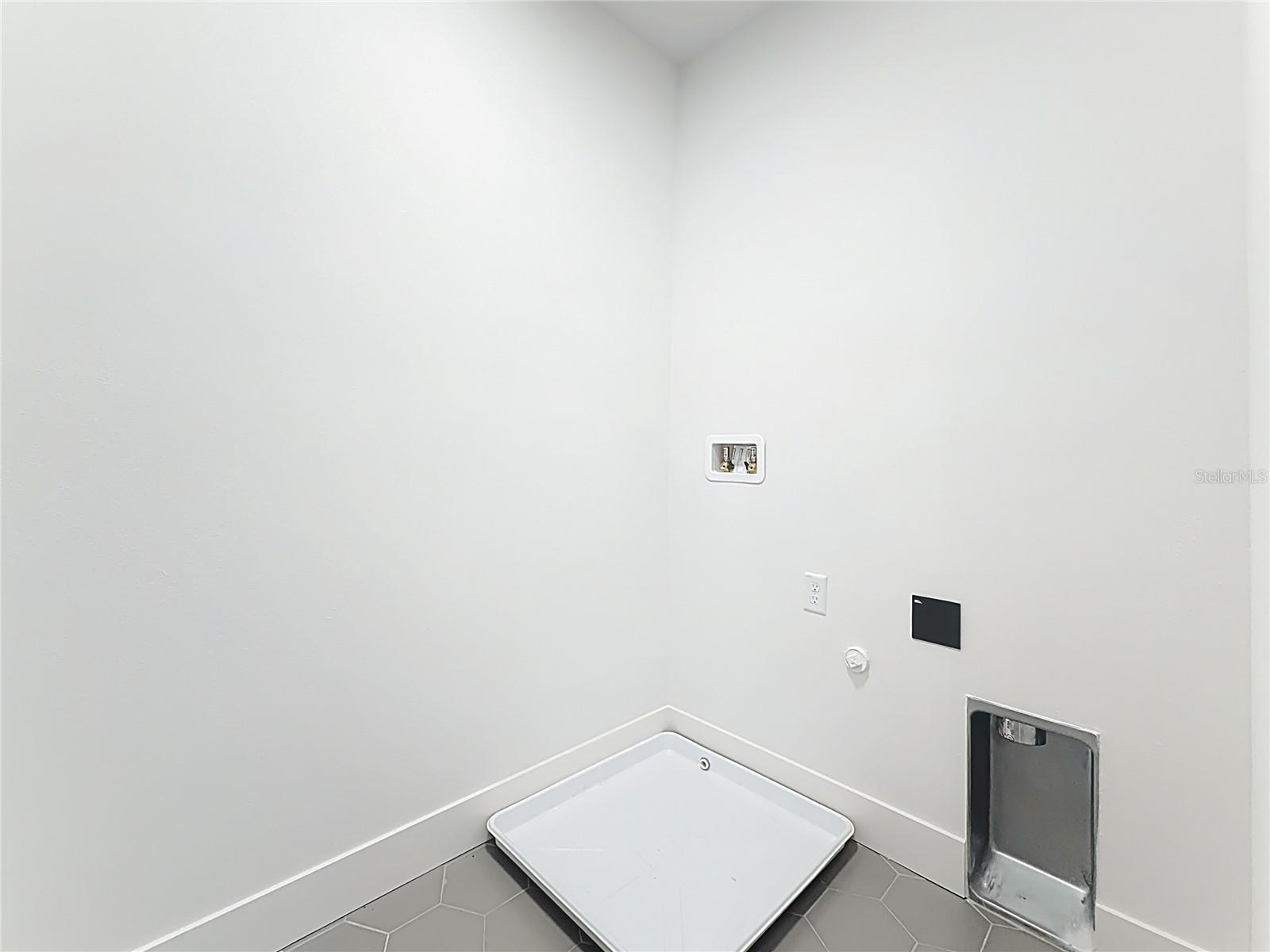 Laundry room with washer and dryer hookups, located on the 2nd floor.