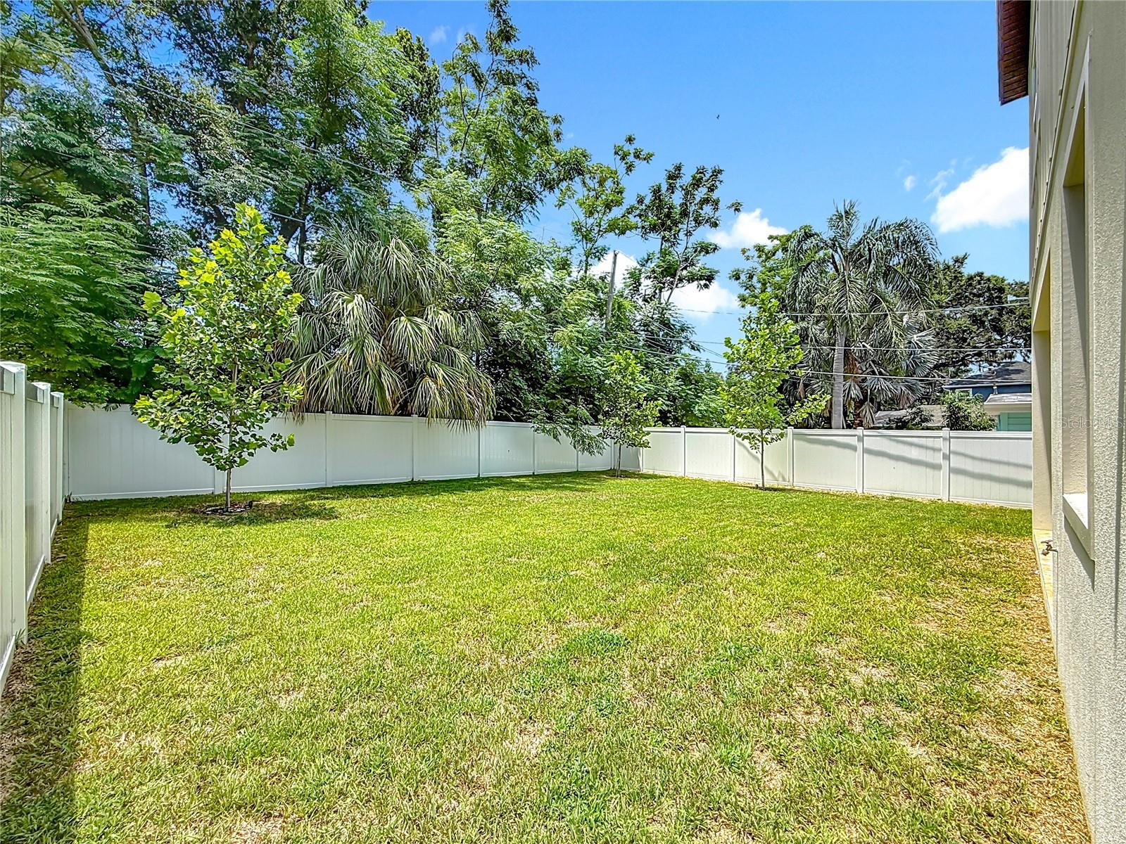 Fully fenced backyard with room for a pool.