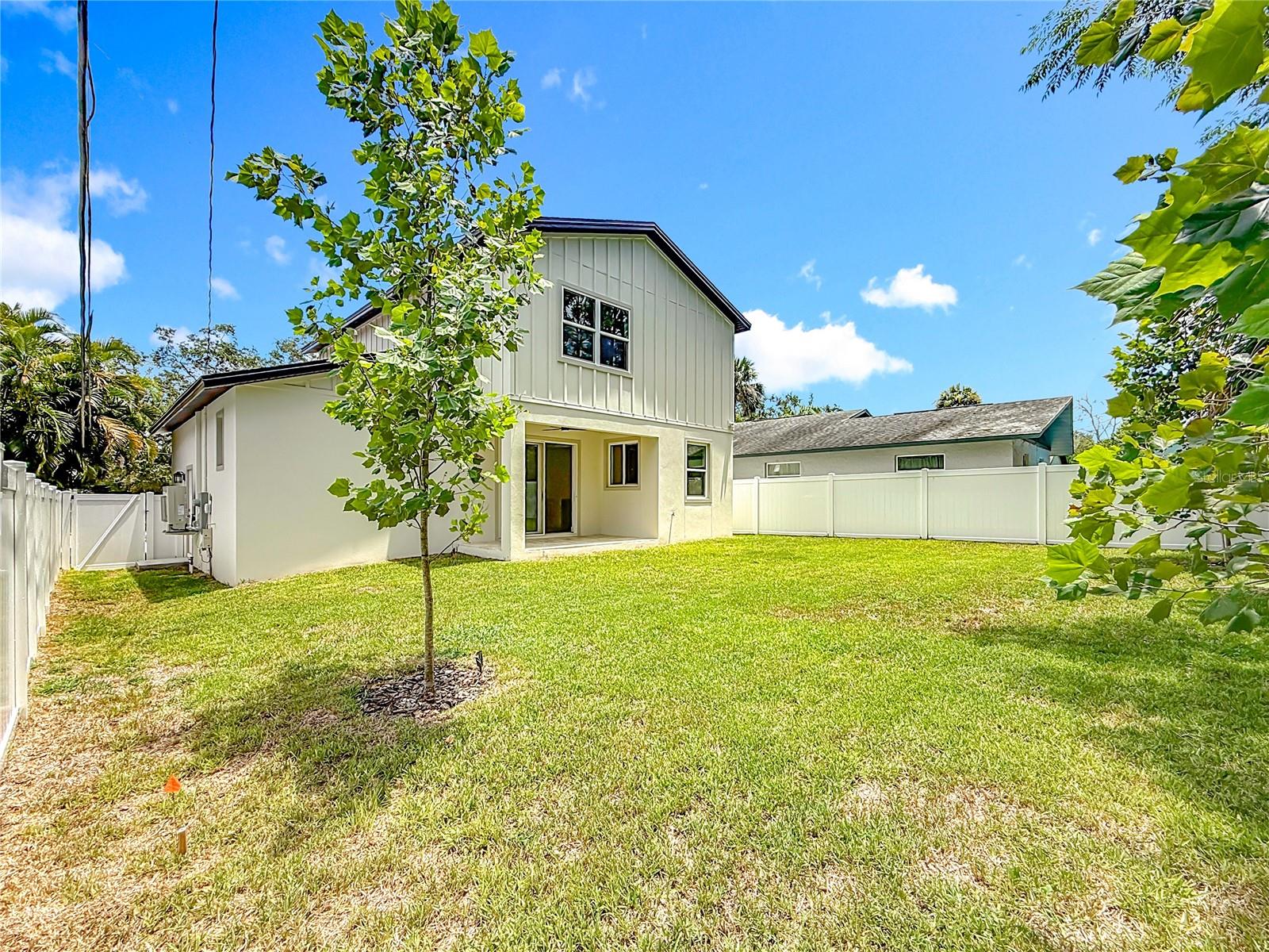 Fully fenced backyard with room for a pool.