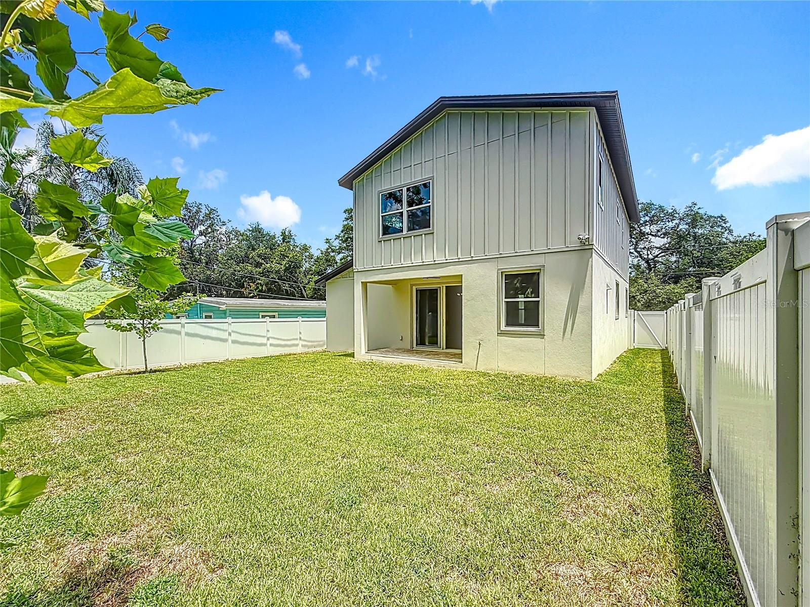 Fully fenced backyard with room for a pool.