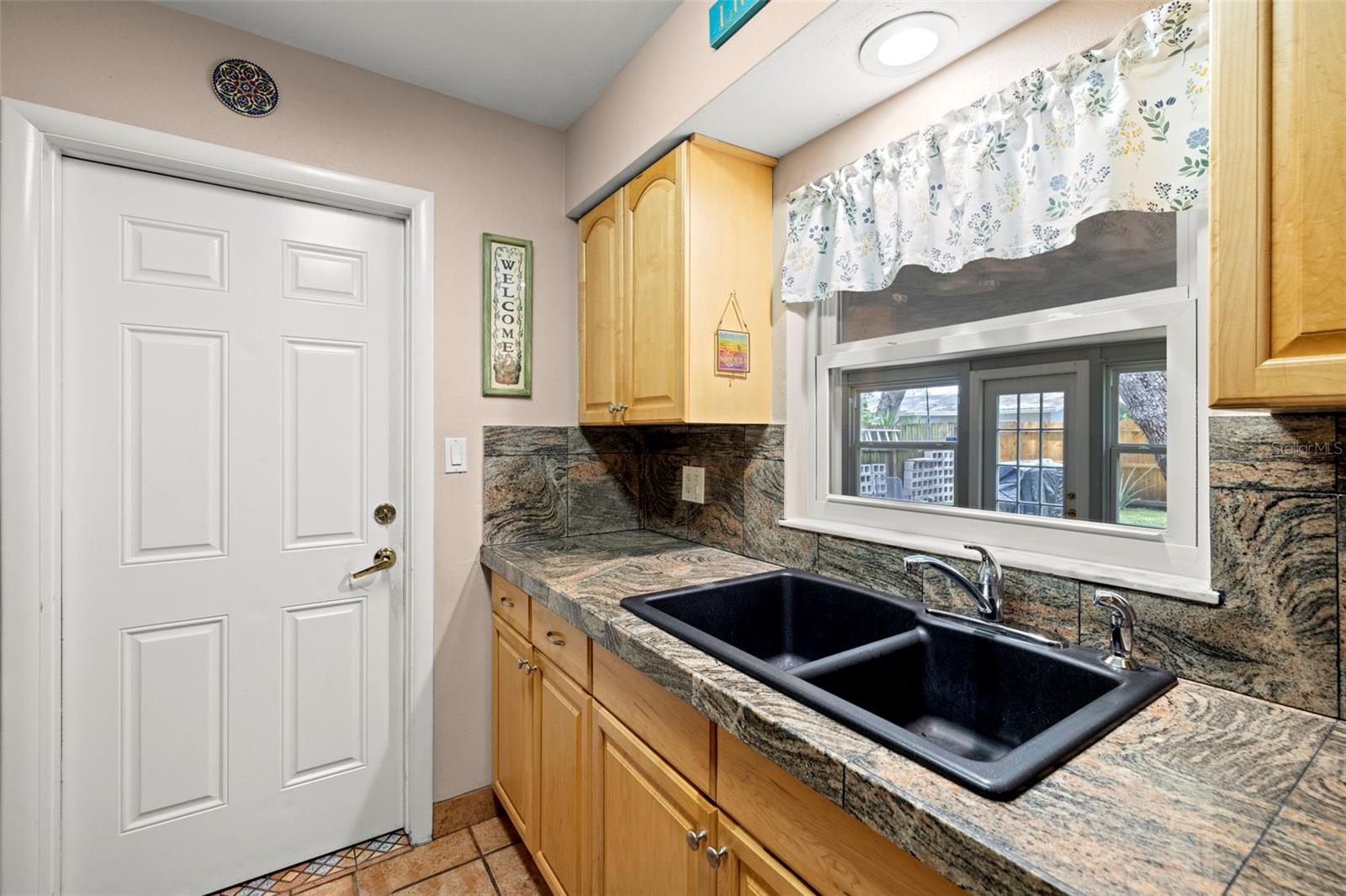 Kitchen leading to garage