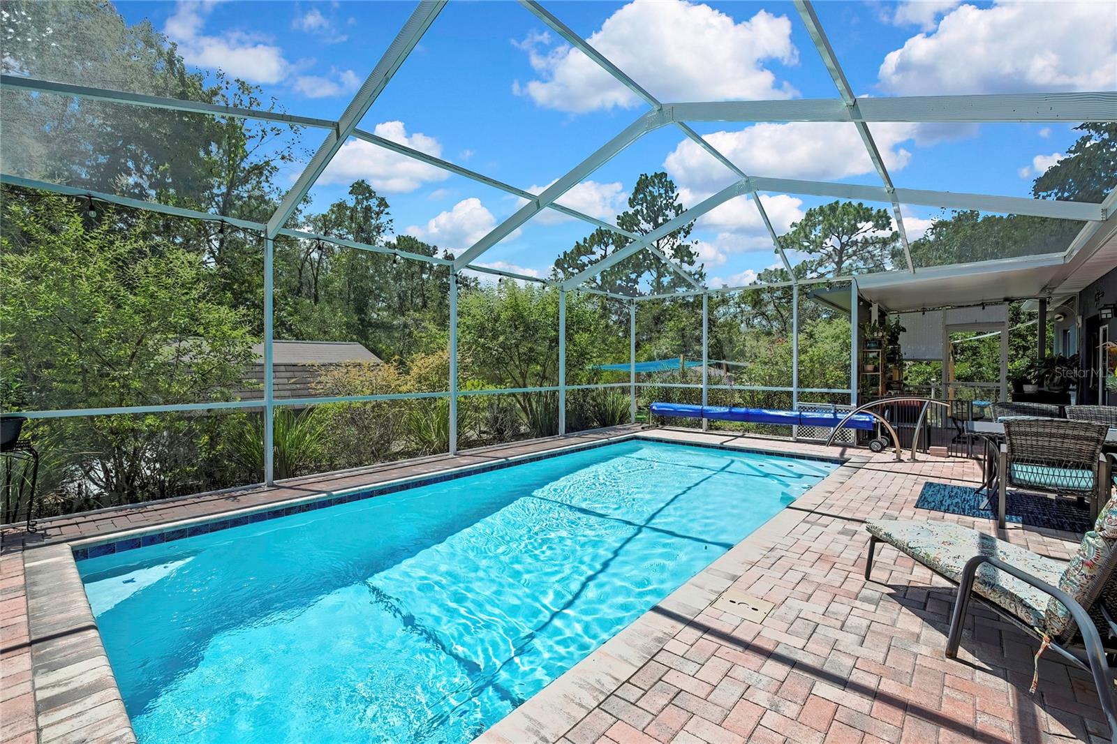 reverse view of pool and patio