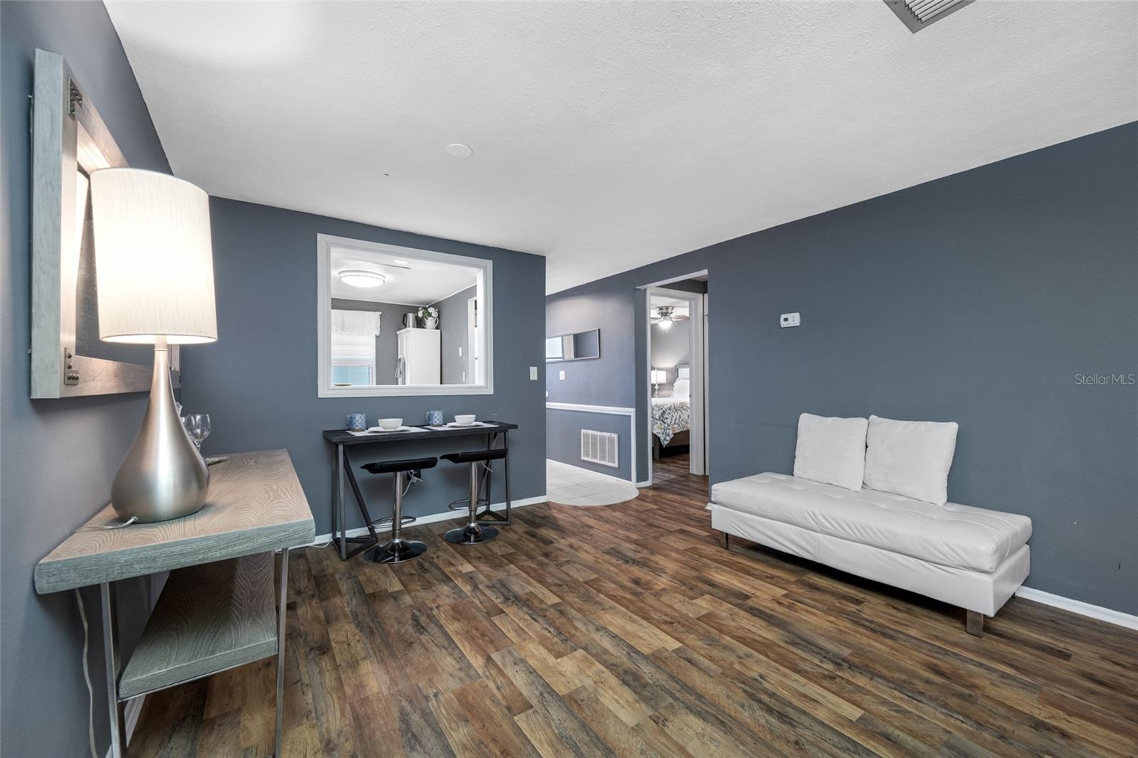 Dining area adjoins kitchen and has a convenient pass through space or could easily be turned into bar seating!