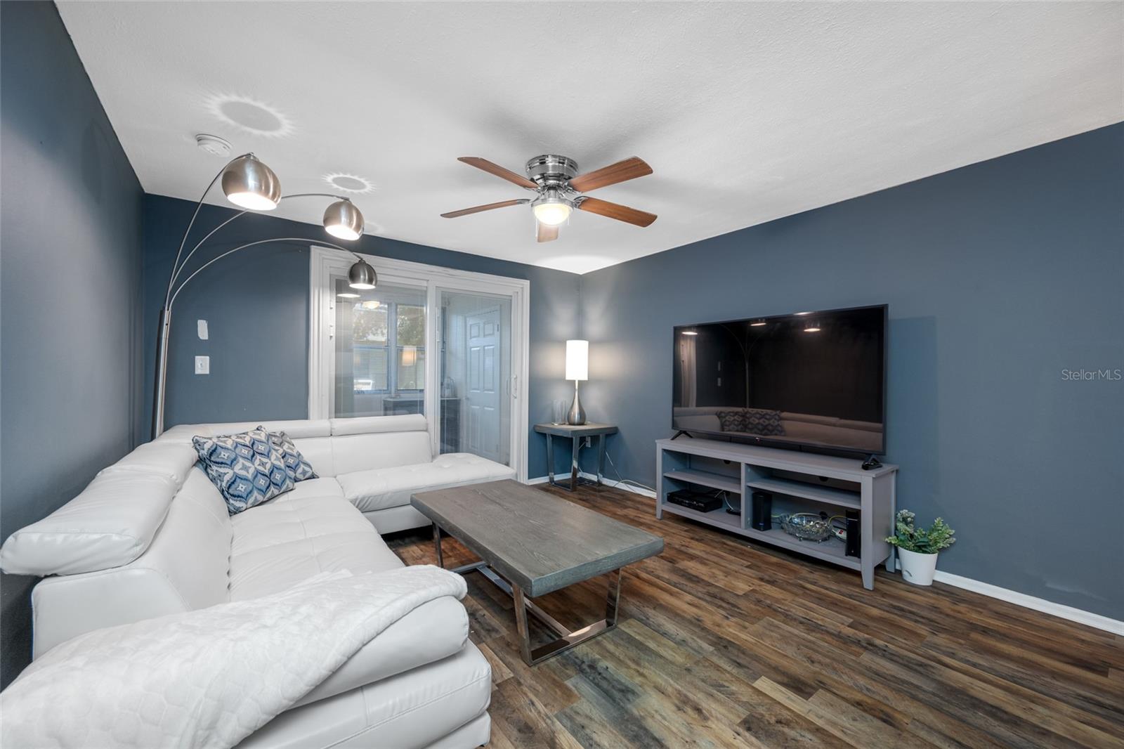 The family room offers ample space for a large TV and couch. Updated double pain slider is a tremedous upgrade and has built in blinds for added privacy when needed.