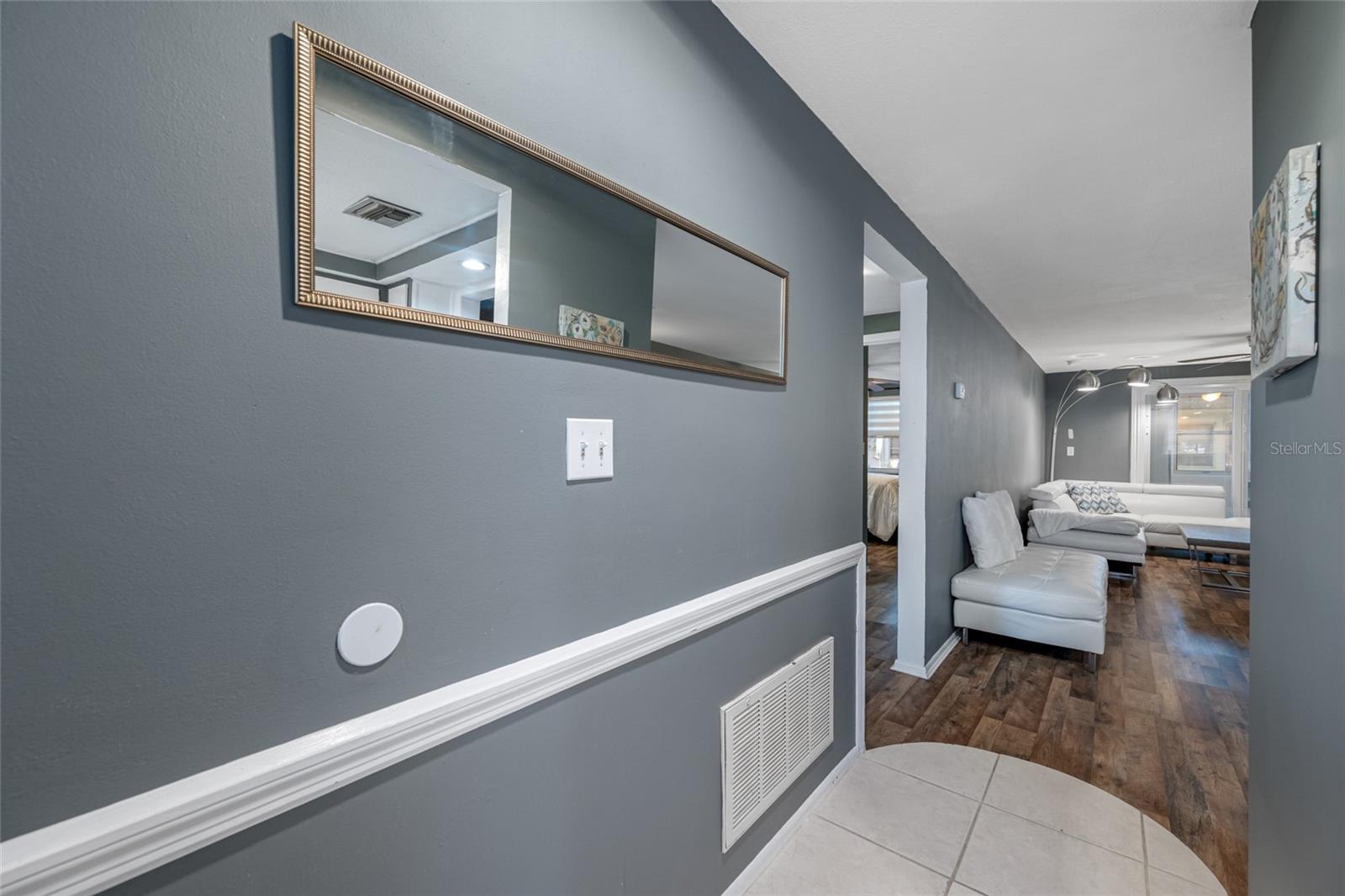 Front entrance has tile and leads into the main living/dining room combo
