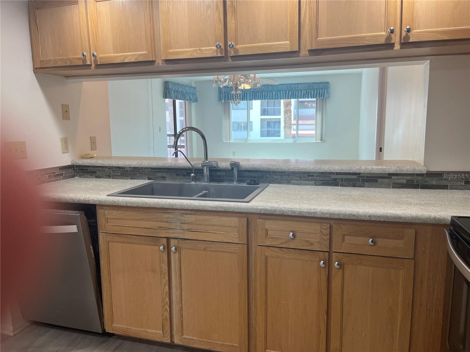 View from your kitchen, looking out into dining And living area
