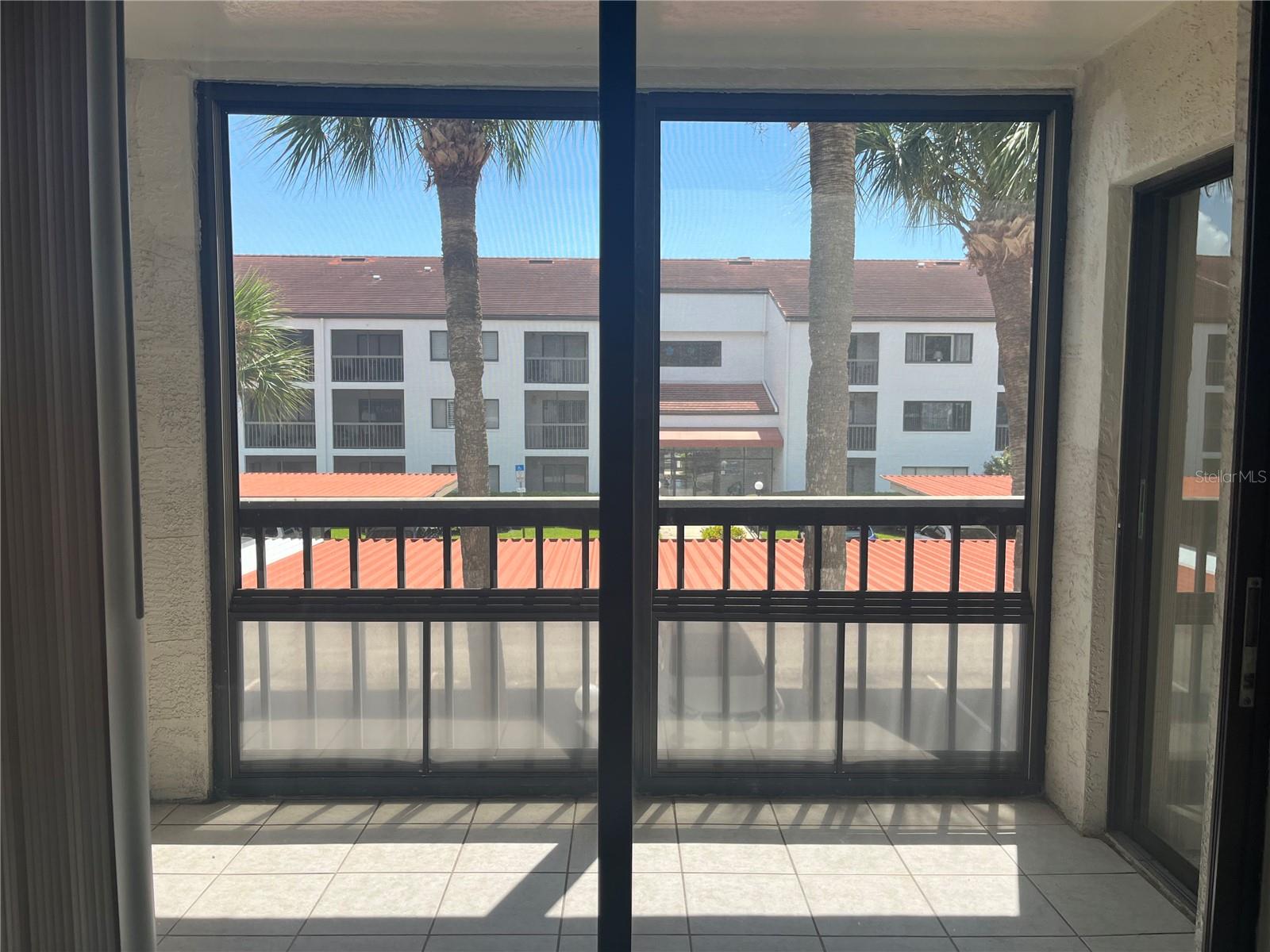 Second bedroom view with two sets of sliders