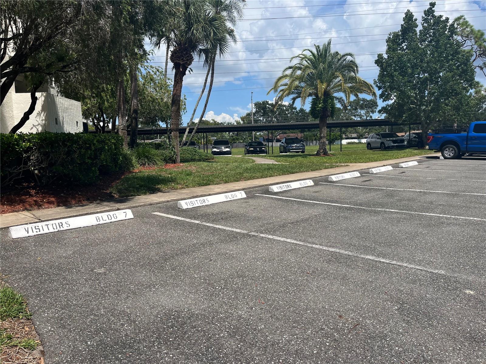 Plenty of visitors parking on either side of building