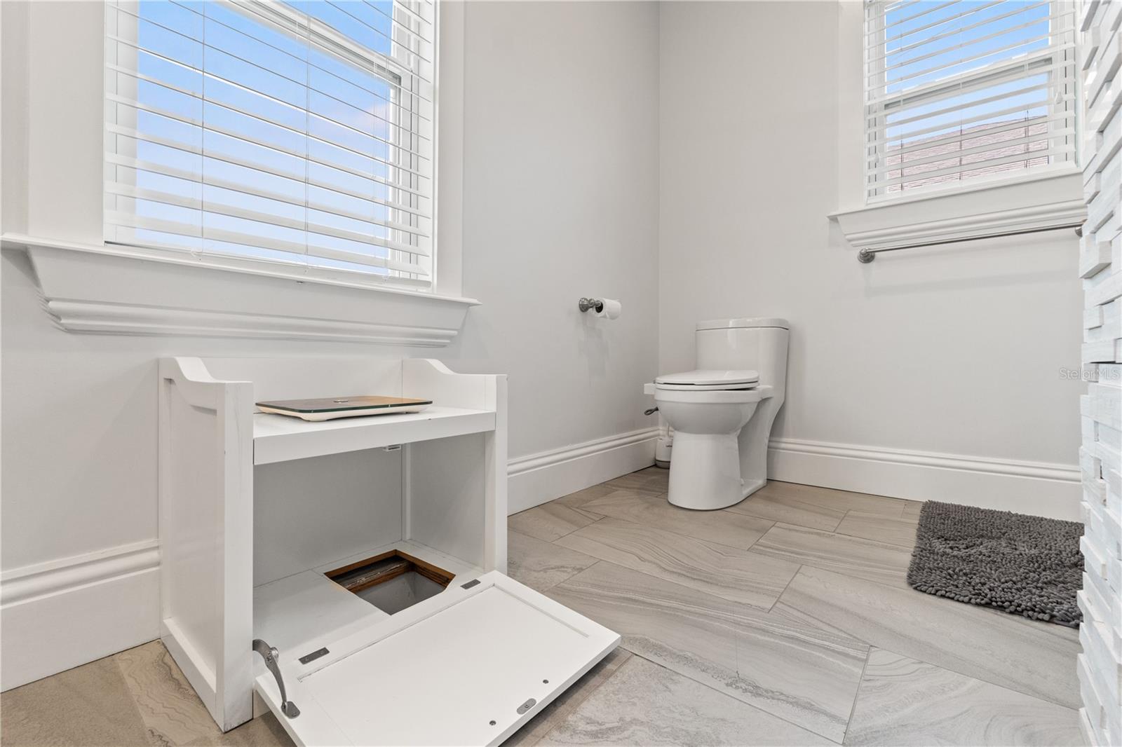 Laundry chute in primary bath