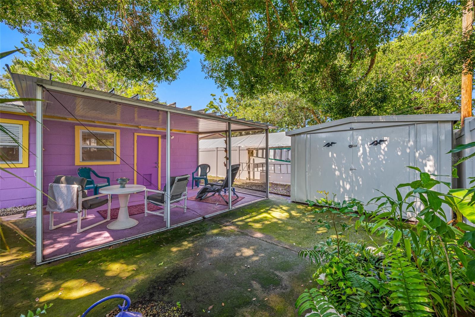 Tree-Shaded & Comfortable Rear Screened Porch