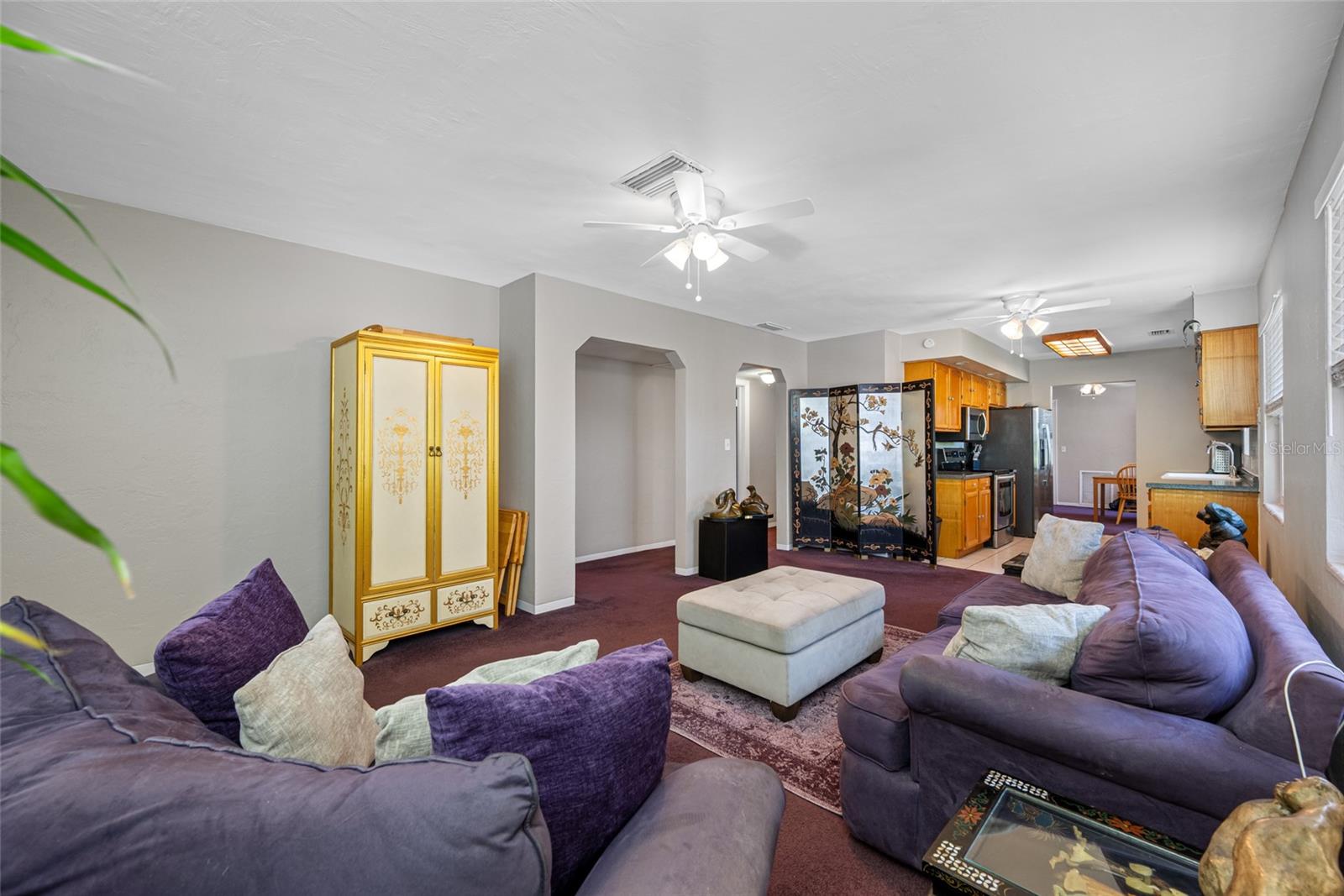 Flexible Living Room Layout: Spacious enough to accommodate multiple seating arrangements & media setups